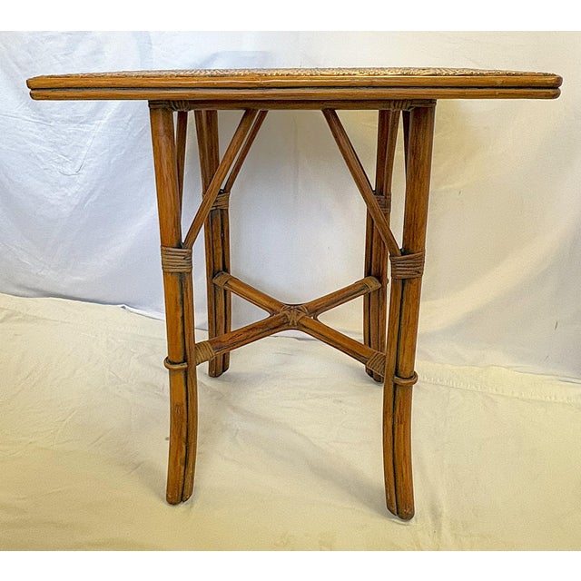 Great vintage Hollywood Regency style dining or game table from the late 20th century. The piece is made of a natural tone...