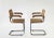 Pair of vintage armchairs with chrome structure, caned seats and backrests, wooden armrests.