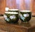Colorful and highly sculptural, this antique three-piece barbotine garniture reflects the naturalistic elegance of the...