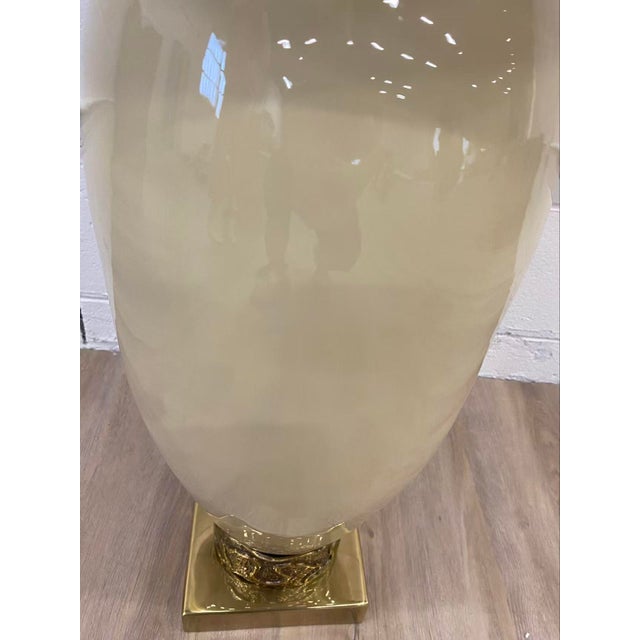 The Delphi Side Table possesses a statuesque quality that makes it a standout in any interior space. Crafted from enameled...