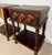 Attractive pair of Spanish nightstands crafted in carved wood, featuring a single drawer, turned supports, and a practical...