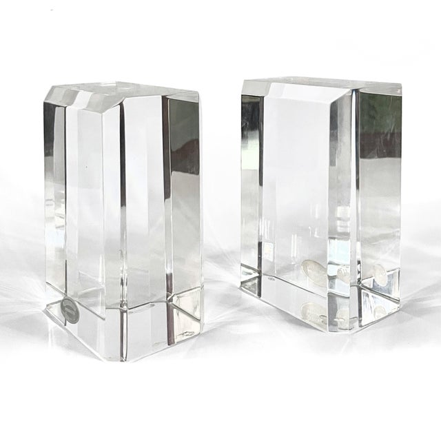 This beautiful pair of thick faceted lucite bookends by Ritts is part of their "Astrolite" line. 6"h X 4"w X 2.75"d