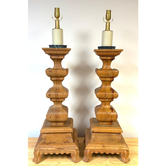 Pair of Monumental Tuscan Carved Pine Column Table Lamps, Rewired. Hand-carved from solid pine, this impressive pair of...