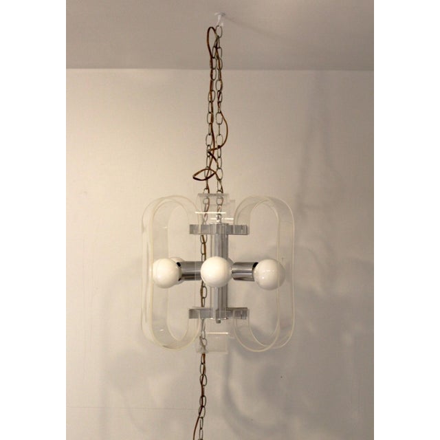 For your consideration is this funky fresh lucite and chrome pendant light chandelier. Dimensions: 16 diam x 156h