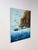 This original oil painting captures a dramatic coastal seascape, featuring a rugged cliff face rising above churning...