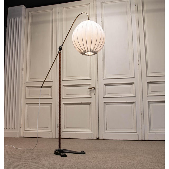 A striking 1940s danish floor lamp by fog & mørup, model “water pump”, a distinctive example of early scandinavian...