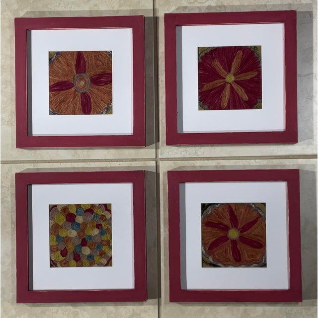 This beautiful set of four Suzani embroidery features intricate geometric and floral patterns, showcasing traditional...