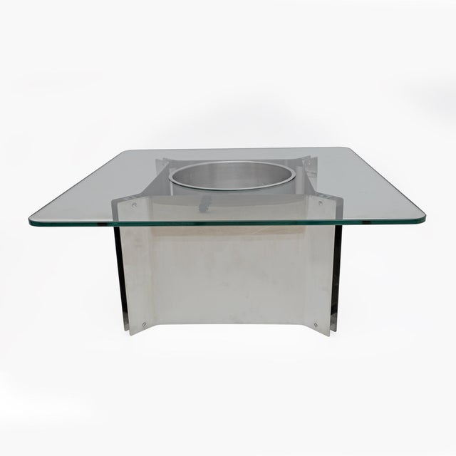 Steel and glass coffee table with bottle holder, probably French production from the 1970s in the style of Michel Boyer....