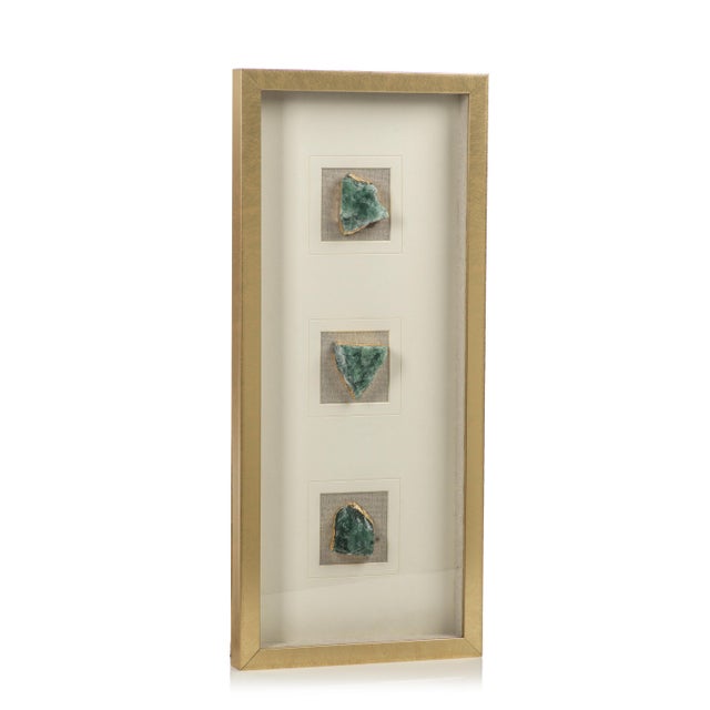 Add an elegant touch to your décor with this very unique framed crystals. The natural crystal wrapped in gold foil gives a...