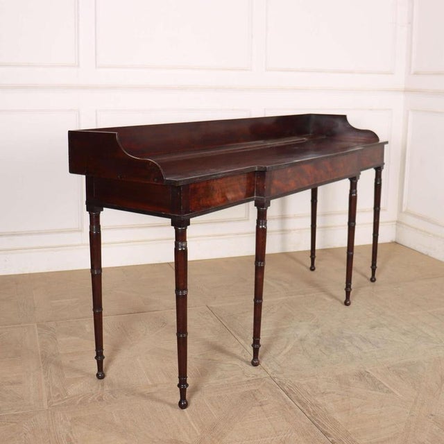Good looking early 19th century English regency breakfront console table with wonderful figured mahogany and great colour....