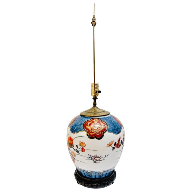 A striking vintage porcelain table lamp, styled after a classic Japanese ginger jar and featuring a vibrant Imari palette...