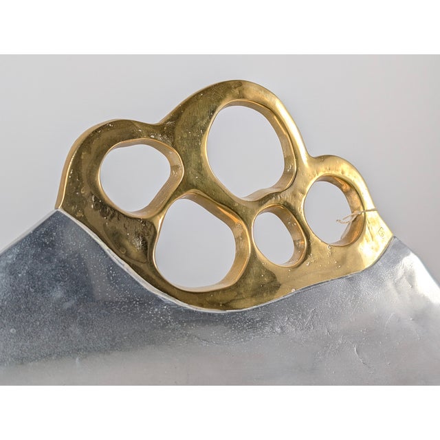 A sculptural vintage log holder designed by David Marshall and manufactured in Spain during the 1980s. The piece is...