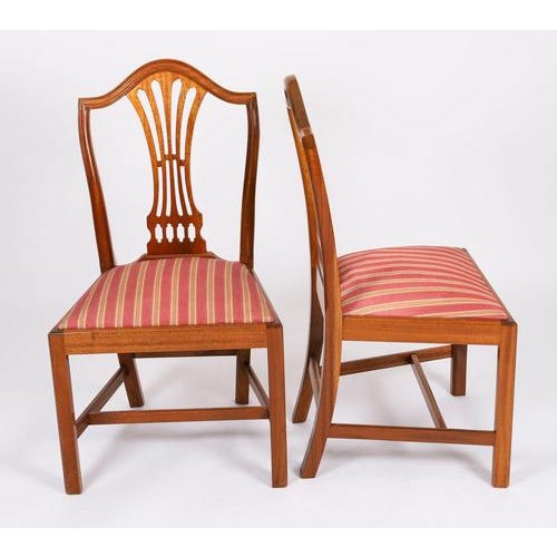This is a beautiful set of six Sheraton Revival shield back dining chairs, made by the Master Cabinet maker William...