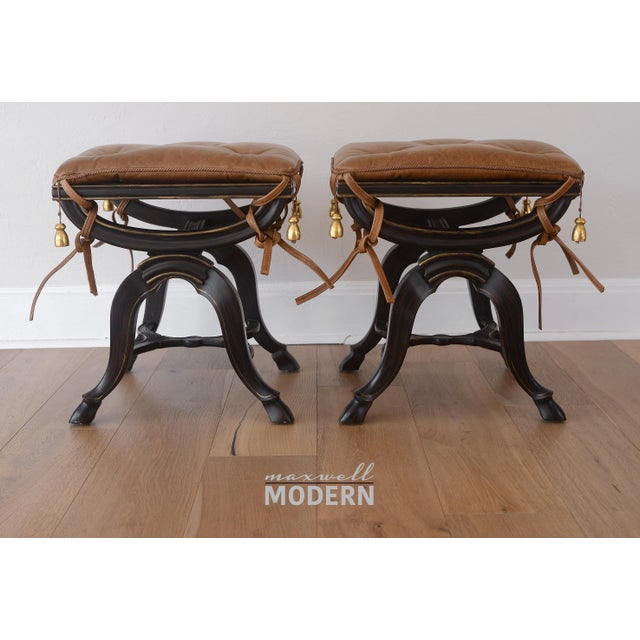 Pair of Neoclassical style X-frame stools from Thomas W. Morgan, a high-end LA-based furniture maker specializing in...