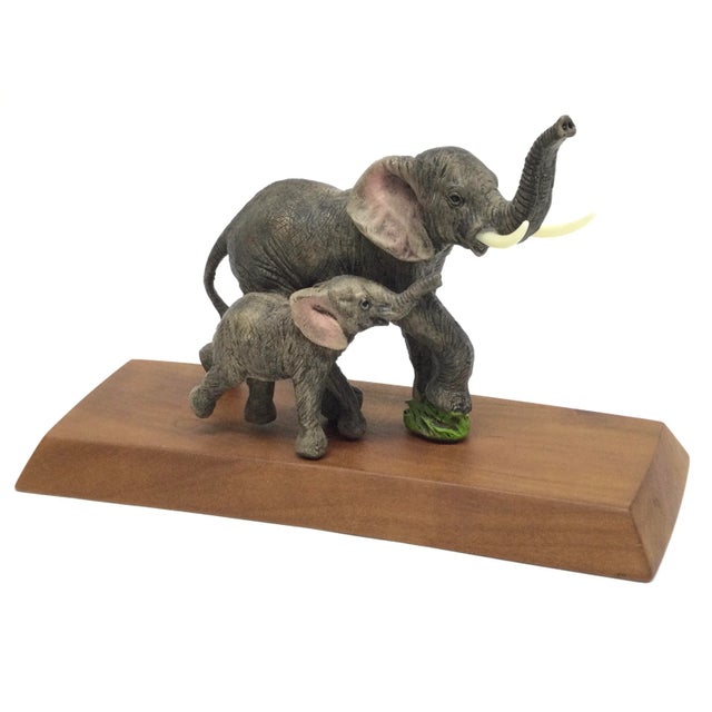 Beautiful resin sculpture of Mother and Baby Elephant. Brought to you by Maitland Smith. This replica of a real life-like...
