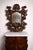 Large Venetian wall mirror in the Louis XV style with five carved wooden arms, richly decorated with rocaille and foliate...