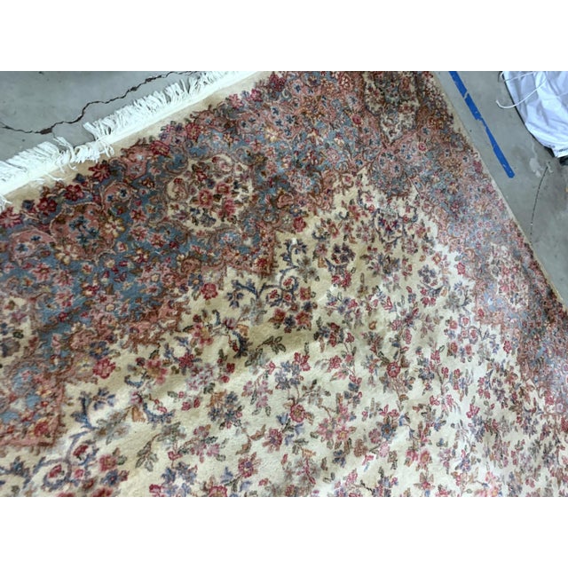Vintage American Karastan rug made in beige wool. The rug has been made in USA with Persian Kerman design. This piece is...