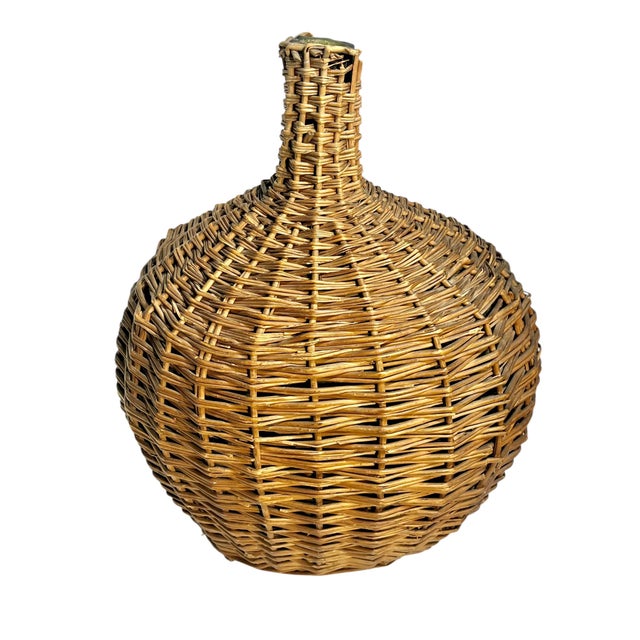 Larger size antique French provincial wicker and glass demijohn. Originally used for storing wine. Green blown glass...