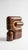 The smallest lamp in the collection, and often the first one people reach for. Its folded form hides the source entirely,...