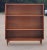American Mid-Century walnut bookcase with two shelves (one of which is adjustable in height) in a rectangular cabinet,...