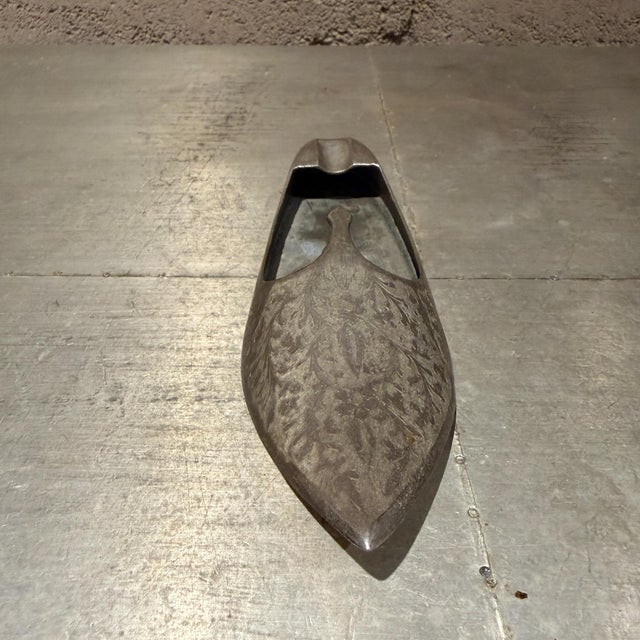 For your consideration, a vintage Indian-style slipper ashtray, likely made of silver-plated brass or similar metal. The...