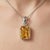 This elegant pendant features a radiant Citrine gemstone, admired for its warm golden hue and vibrant brilliance. Often...
