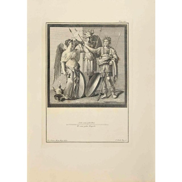 Victory and Trophies from "Antiquities of Herculaneum" is an etching on paper realized by Carlo Norlli in the 18th...