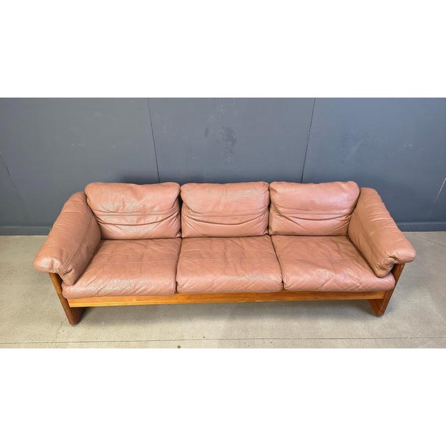 Beautiful solid teak wood sofa wiyth camel brown leather cushions. Designed by Mikael Laursen in the 1970s Very comfy...