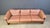 Beautiful solid teak wood sofa wiyth camel brown leather cushions. Designed by Mikael Laursen in the 1970s Very comfy...