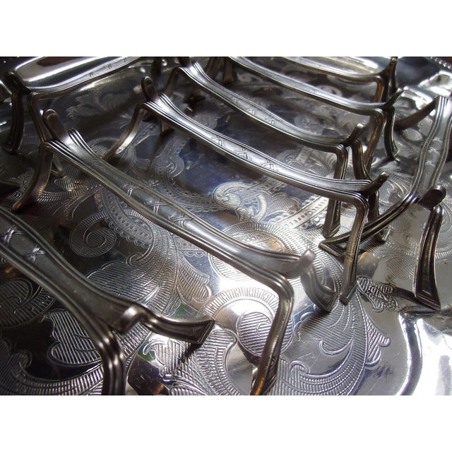 9 antique, silver-plated knife rests from Christofle, timeless and elegant in the fillet shape. This piece has an...