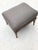 Newly fabric upholstered ottoman in gray silver tone linen. Faux pickling effect on fruitwood legs. A very comfortable...