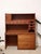 A beautifully functional vintage secretary desk with warm teak tones and a wonderfully architectural mid-century...