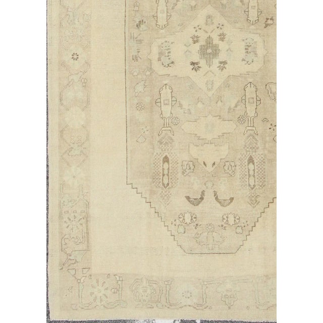 Faded Turkish Oushak Rug With Cream and Brown Central Medallion 5'6 X 8'6 For Sale - Image 4 of 10