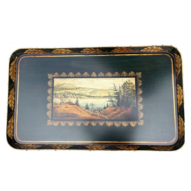 A fine vintage tray painted tray coffee table with a scenic image. The tray is rectangular in form and is painted with a...