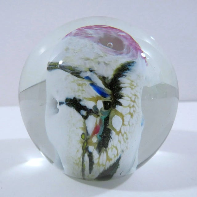 Colorful small glass paperweight from Seattle-based Glass Eye Studio, created with volcanic ash from the 1980 eruption of...