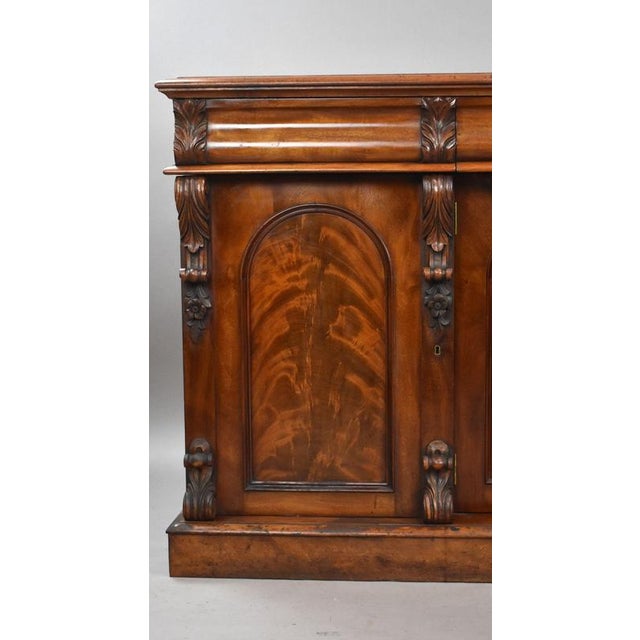 Victorian Flame Mahogany Four-Door Sideboard A substantial Victorian flame mahogany sideboard, dating from circa 1860. The...