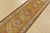 A tribal Caucasian Kazak runner hand-knotted with fine wool on a cotton foundation. This rug features a row of geometric...