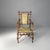 Italian art deco armchairs in fabric and bamboo, 1930s Pair of armchairs with dark brown bamboo frames, characterized by...