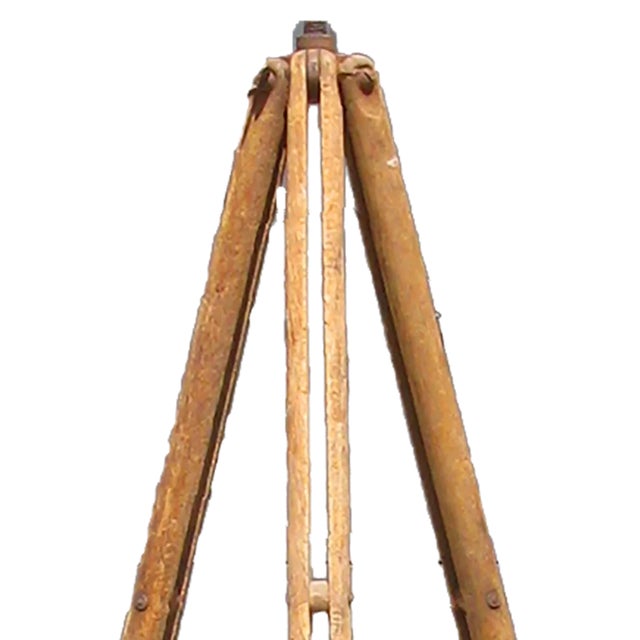 Handsome vintage wood surveying tri-pod with metal leg caps. Perfect on its own as an as-found decorative accent or as the...