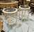 Elegant French-style side table featuring a luxurious black marble top framed with a delicate gold-leaf border. The table...