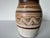 Beautiful vintage studio art pottery vase featuring an organic, hand-thrown form with rich earth-tone glazing. This piece...