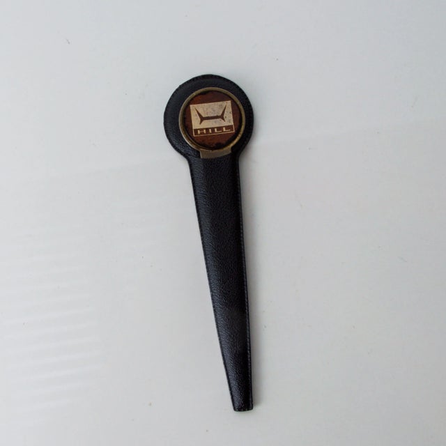 For your considerattion a Mid Century Modern Advertising Letter Opener by Hill. The letter opener has the original cover...