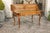 A French Louis XV style walnut desk from the early 19th century, with lifting panel, green leather writing surface and...