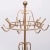 Very nice standing coat rack. Gold color metal. France provincial in style. 1950s.