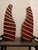 A striking pair of hand-carved sculptural totems crafted from bamboo with a deep oxblood red finish. These abstract,...
