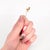 A fine vintage gold stickpin. In 14 karat yellow gold with ruby eyes. In the form of an sand piper. Marked to the reverse...