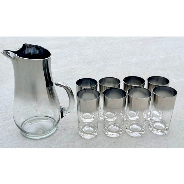 Iconic 9-piece Mid-Century Modern barware collection by Dorothy Thorpe. Dating to the 1960s, this incredibly rare expanded...