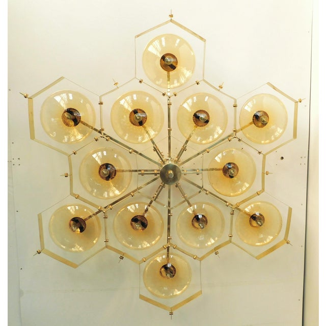 Italian midcentury flush mount with twelve amber Murano glass shades carefully hand blown with bubbles inside the glass...