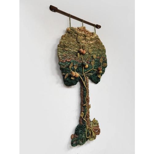 Get in touch with nature with this beautiful vintage macrame wall hanging from the 1960s. It features various colors that...