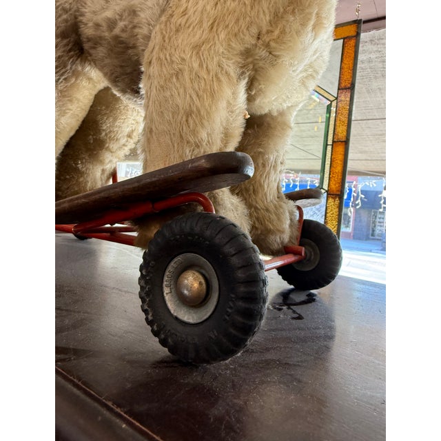 Manufacturer: Lines Bros. Ltd., often branded under Tri-ang Toys. Materials: Features a mohair plush covering over a steel...